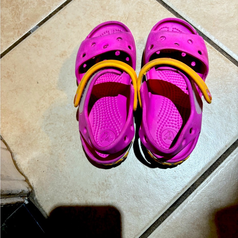 Crocs pink Sandals size 10 very cute in used condition